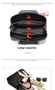 Detailed view of black crocodile pattern bag interior showing multiple storage compartments