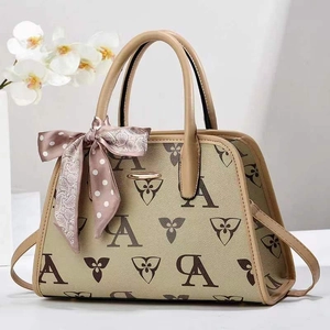 Retro monogram trapezoid handbag in beige with floral patterns and silk scarf handle