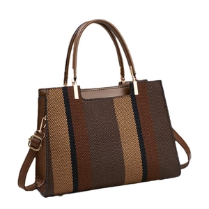 Brown and black striped texture tote bag with golden hardware and leather strap