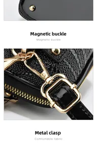 Detail of lizard pattern leather texture with bottom studs and golden metal hardware buckles