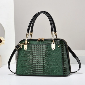 Dark green lizard pattern shell handbag with gold zippers and black handles for women