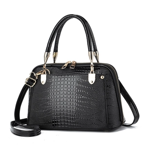 Elegant black lizard pattern faux leather tote bag with gold hardware and shoulder strap
