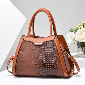 Brown faux lizard leather tote bag for women with gold hardware and shoulder strap