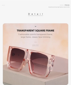Detail of pink transparent square frames on a matte stand with soft lighting
