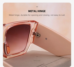 Close-up of durable silver metal hinge on translucent orange fashion sunglasses
