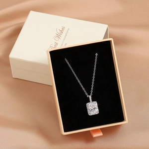 Elegant rectangle cubic zirconia pendant necklace on a champagne satin gift box
