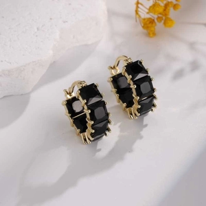Vintage gold-plated hoop earrings with square black zircon stones on white stone base