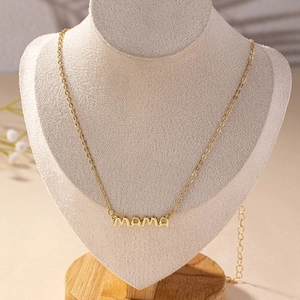 Elegant gold MAMA letter necklace on jewelry bust featuring a polished finish chain