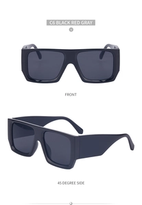 Detail view of oversized square sunglasses featuring thick temples and a dark grey lens