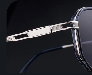 Macro view of blue translucent frame with silver hollowed metal spring hinge detail