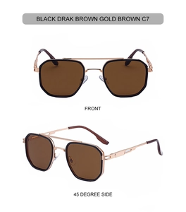 Detail of pilot sunglasses with gold-black metal frame and engraved spring hinge