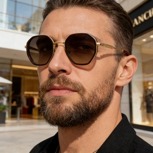 Retro hexagonal gold metal sunglasses with bamboo texture temples and gradient brown lenses