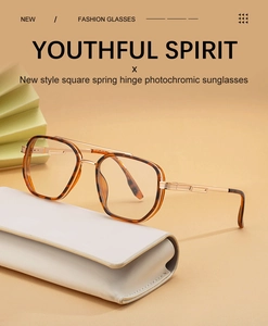 Detail of square photochromic sunglasses with tortoiseshell frame and golden spring hinges