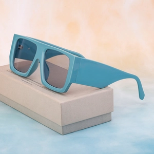 Sky blue oversized square sunglasses with wide temples shown at 45-degree angle