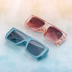 Oversized retro square sunglasses with thick frames in teal blue and peach orange colors