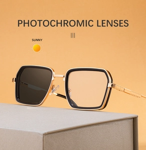 Detail of square photochromic lenses showing light to dark transition in metal frame