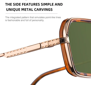 Detail of square sunglasses featuring light gold metal temples with rectangular engraving