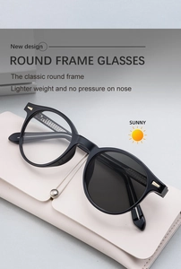 Detail of round photochromic sunglasses with lightweight frame and leather storage case