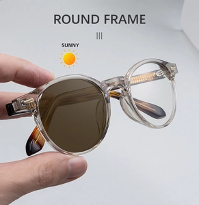 Detail showing light-sensitive photochromic round lenses changing color in the sunlight