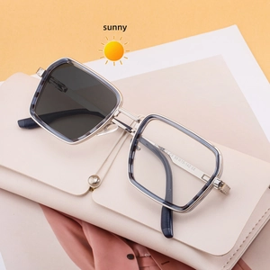 Close-up of square metal sunglasses with marble texture frame and spring hinges