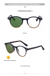 Detail view of round photochromic sunglasses with tortoise frame and green-tinted lenses