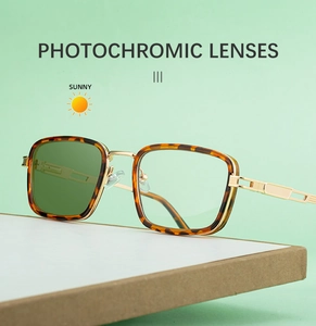 Detail of tortoiseshell square sunglasses with photochromic lenses and hollow gold temples