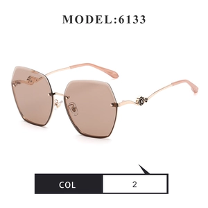 Detail of rose gold metal temple featuring an elegant rose-shaped craftsmanship on rimless lens