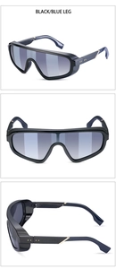 Close-up of steampunk oversized sunglasses with black frame and blue temples and gold studs
