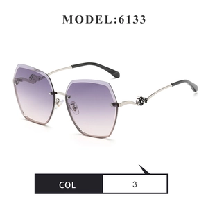 Detail of metal temple with black rose relief on gradient purple rimless sunglasses