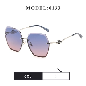 Detail of rimless hexagonal sunglasses with gradient lenses and rose metal temple