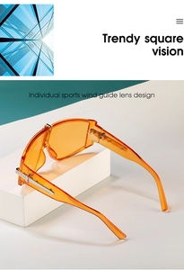Orange oversized square sports sunglasses with wind guide lens and silver metal temple
