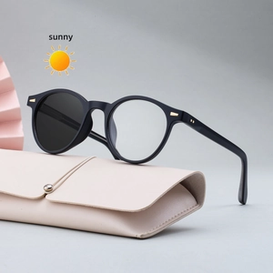Women's round black frame photochromic sunglasses with elegant beige leather case