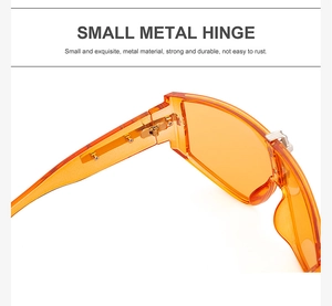 Detail view of durable small metal hinges on translucent orange fashion sunglasses