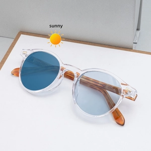 Fashionable round sunglasses with transparent frames and tortoiseshell temples for outdoor