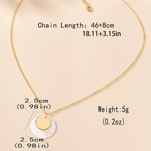 Golden double layer shell pendant necklace with size specs on a stone background