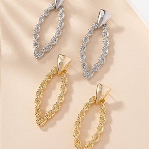 Elegant twisted rope texture earrings in gold and silver finish with oval pendants