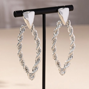 Elegant silver twisted rope oval earrings on display, stylish minimalist jewelry set