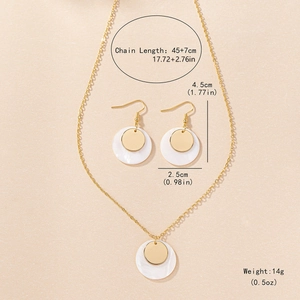 Elegant gold jewelry set with round shell pendants including necklace and earrings