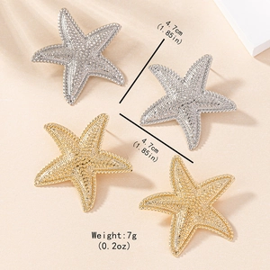 Elegant gold and silver starfish stud earrings with sparkling textured surface details