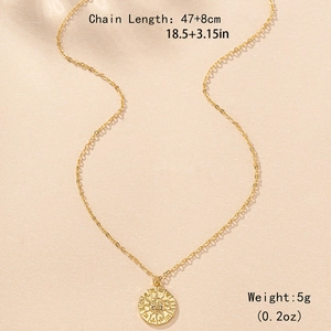 Golden sun medallion necklace with zodiac embossing and elegant link chain