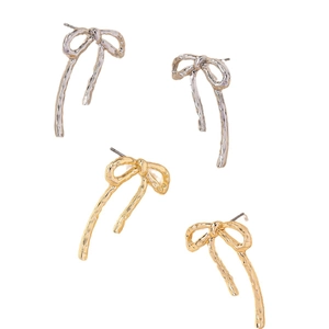 Minimalist gold and silver bow stud earrings with a textured lava finish for women