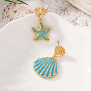 Asymmetrical starfish and seashell earrings in gold and blue for summer beach style