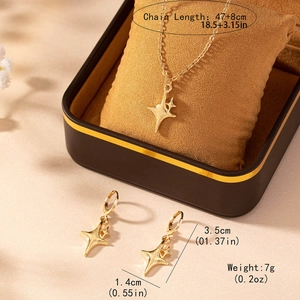 Elegant gold four-pointed star pendant necklace and earrings jewelry set in a gift box