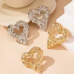 Lava texture hollow heart earrings in gold and silver finish with minimalist style