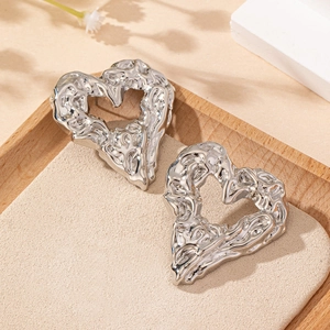 Hollow heart stud earrings with silver lava texture finish for a minimalist style