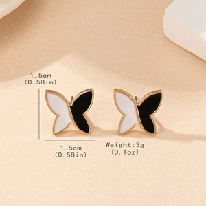 Minimalist black and white butterfly stud earrings with gold plating and 1.5cm size