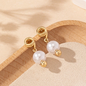 Elegant gold spiral pearl drop earrings with minimalist French vintage aesthetic style
