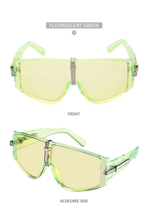 Detail of fluorescent green oversized sunglasses with silver metal bridge and side accents