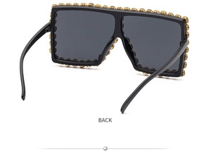 Detailed back view of oversized square sunglasses with sparkling rhinestone embellishments