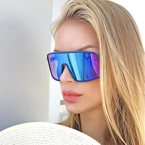 Close-up of steampunk square sunglasses with bright blue mirrored lenses on a male model